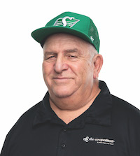 A portrait of Gordon Ross in a black polo shirt and green baseball hat. He is a Farm and Commercial Specialist for The Co-Operators.